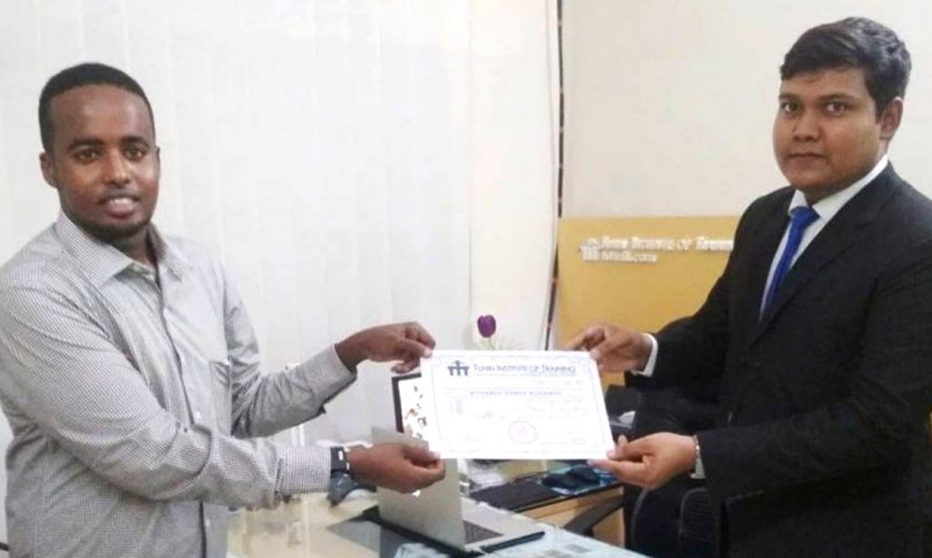 A Foreigner Getting Certificate After Completion of Training From Tuhin Institute of Training